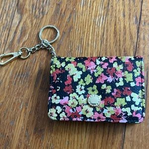 Floral pattern Steve Madden card holder with gold hardware
